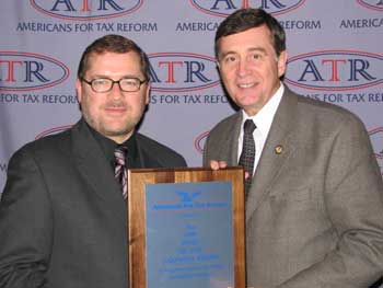 Photo 1: Congressman Gil Gutknecht receives the "Taxpayer Hero Award" from Americans for Tax Reform President Grover Norquist for his work during the 109th Congress.
